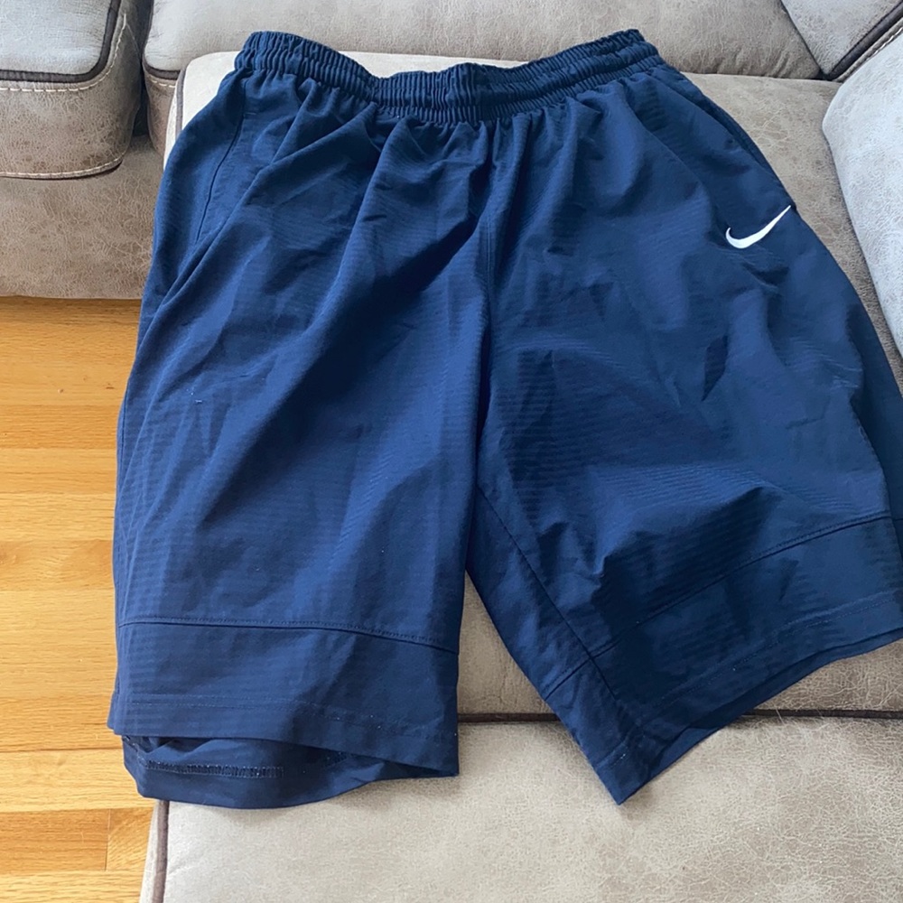 Dark navy blue basketball shorts with pockets
